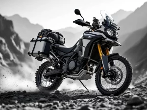 Fully loaded adventure motorcycle with panniers and gear on rocky mountain terrain in black and white