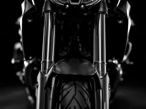 Adventure motorcycle inverted front fork suspension with chrome stanchions in dramatic black and white close-up